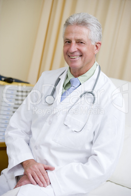 A Doctor Sitting On A Hospital Bed