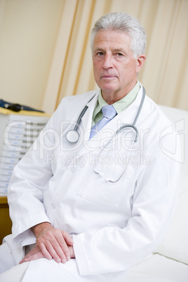 A Doctor Sitting On A Hospital Bed