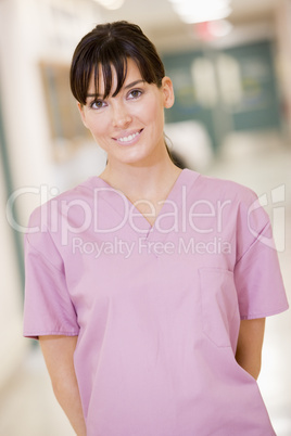 Nurse Standing In A Hospital Corridor