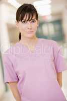 Nurse Standing In A Hospital Corridor