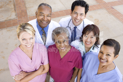 High Angle View Of Hospital Staff Standing Outside A Hospital