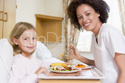 Nurse Feeding Young Girl