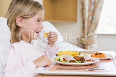 Young Girl Eating Hospital Food