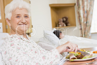 Senior Woman Eating Hospital Food