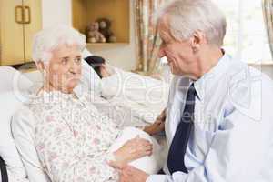 Senior Man Sitting With His Wife In Hospital