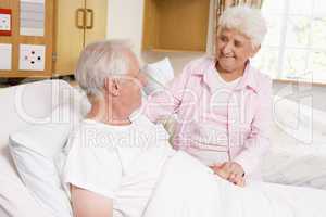 Senior Woman Visiting Her Husband In Hospital