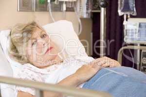 Senior Woman Sleeping In Hospital Bed