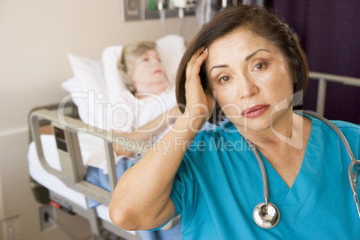 Stressed Out Doctor In Patients Room