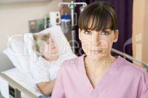 Nurse Standing In Patients Room