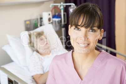 Nurse Standing In Hospital Room,Smiling