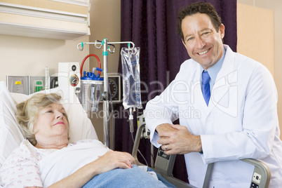 Doctor Checking Up On Patient In Hospital