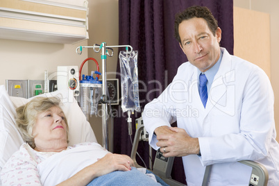 Doctor Checking Up On Patient In Hospital