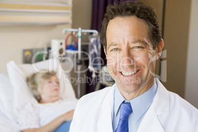 Doctor Standing In Patients Room