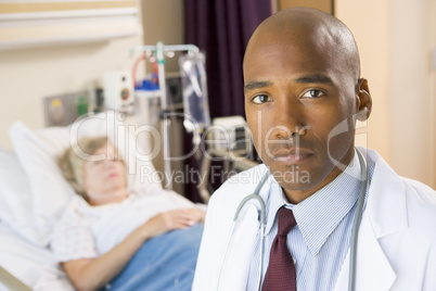 Doctor Looking Serious In Hospital Room,Senior Woman Lying In Ho