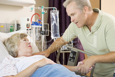 Middle Aged Man Visiting His Mother In Hospital