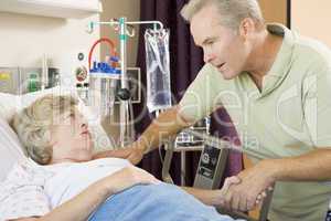 Middle Aged Man Visiting His Mother In Hospital