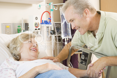Mother And Son Laughing Together In Hospital