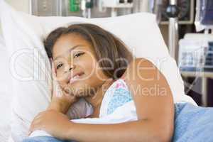 Young Girl Lying Down In Hospital Bed
