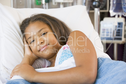 Young Girl Resting In Hospital Bed