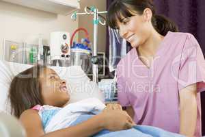Nurse Talking To Young Patient