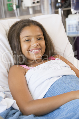 Young Girl Lying In Hospital Bed