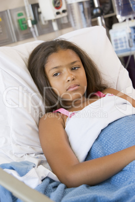 Young Girl Lying In Hospital Bed