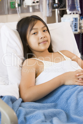 Young Girl Lying In Hospital Bed