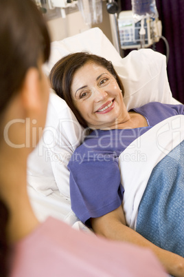 Senior Woman Lying In Hospital Bed,Smiling