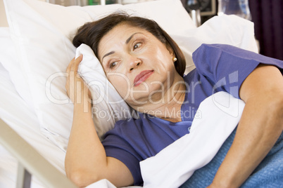 Senior Woman Lying Down In Hospital Bed