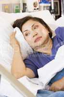 Senior Woman Lying Down In Hospital Bed
