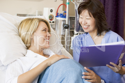 Pregnant Woman Talking To Doctor