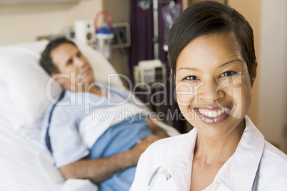Doctor Smiling In Hospital Room