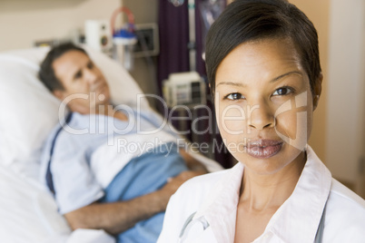 Doctor Looking Serious,Standing In Hospital Room