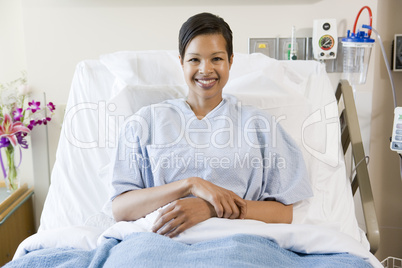 Woman Sitting In Hospital Bed