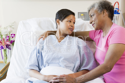 Mother And Daughter Looking At Each Other In Hospital