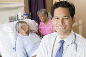 Doctor Looking Cheerful In Hospital Room