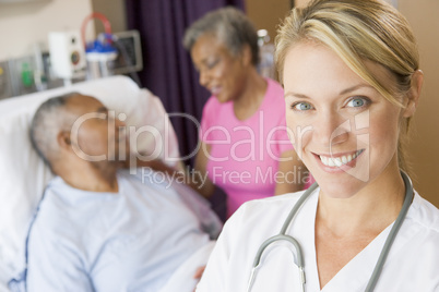 Doctor Smiling,Standing In Patients Room
