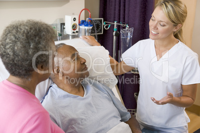 Doctor Explaining To Senior Couple