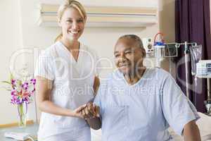 Nurse Helping Senior Man To Walk