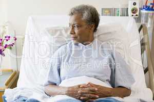 Senior Woman Sitting In Hospital Bed