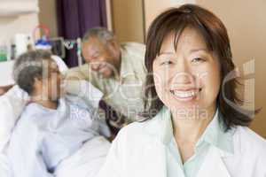 Nurse Smiling In Hospital Room