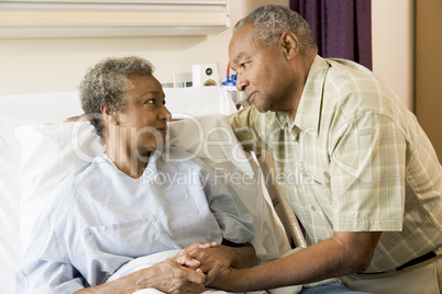 Senior Couple Standing In Hospital Together