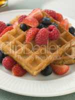 Plate Of Waffles With Berries And Maple Syrup