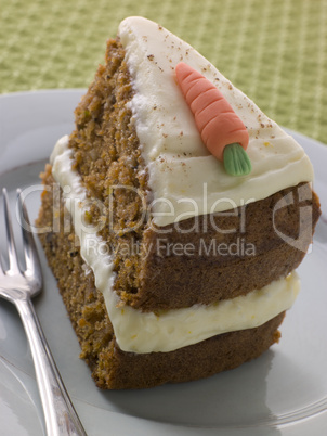 Slice Of American Carrot Cake On A Plate With A Fork