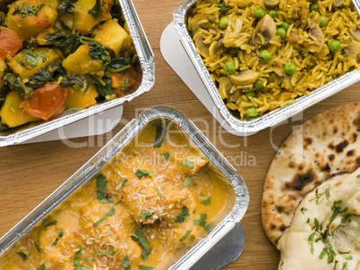 Selection Indian Take Away Dishes In Foil Containers