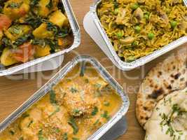 Selection Indian Take Away Dishes In Foil Containers