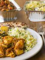 Plate Of Indian Take Away- Chicken Bhoona, Sag Aloo, Pilau Rice