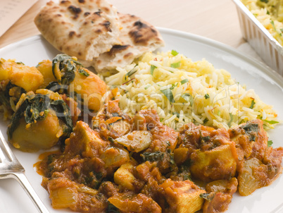 Chicken Bhoona, Sag Aloo, Pilau Rice And Naan Bread