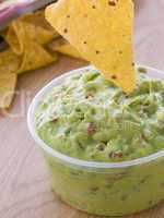 Pot Of Guacamole With A Corn Tortilla Crisp