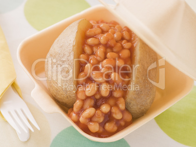 Baked Potato With Baked Beans And Cheese In A Take Away Box